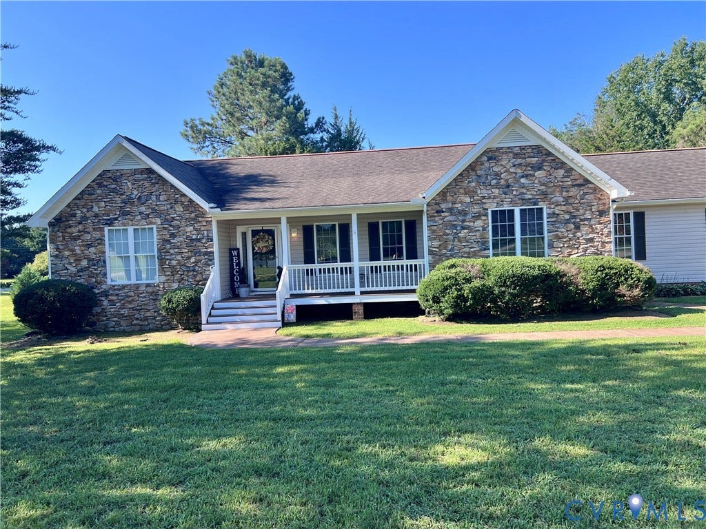 2301 Graceland Drive, Powhatan, VA 23139 Ranch-style residence featuring a stone and siding exterior, a covered front porch, and a gravel pathway