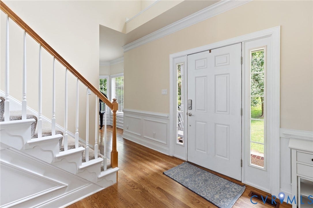 8343 Shagreen Court, The Highlands, Chesterfield, VA 23838 Hardwood flooring, paneled entry door with sidelights, staircase with wood handrail, wainscoting, and crown molding