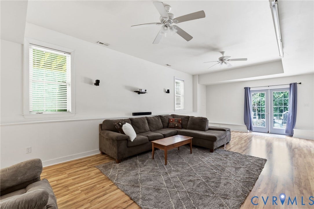 8343 Shagreen Court, The Highlands, Chesterfield, VA 23838 Wood-finish flooring throughout, multiple ceiling fans, and white walls
