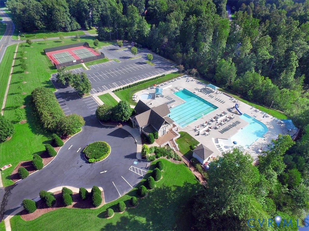 8343 Shagreen Court, The Highlands, Chesterfield, VA 23838 Expansive swimming pool with a dedicated lap lane, separate recreation pool, and adjacent tennis courts