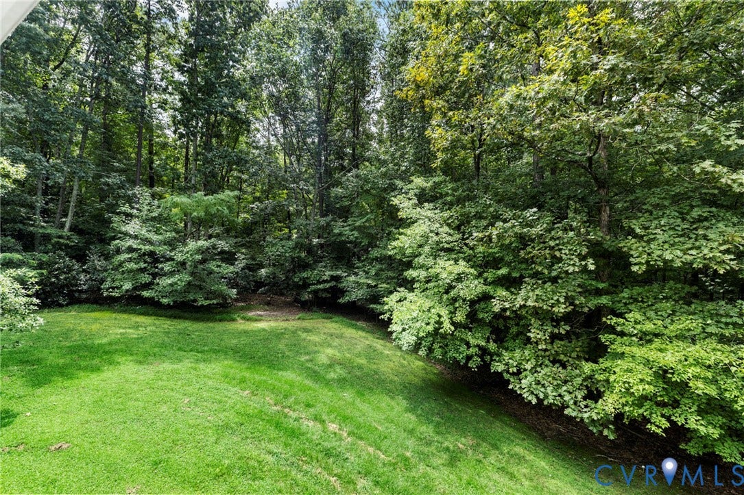 8343 Shagreen Court, The Highlands, Chesterfield, VA 23838 Expansive green lawn surrounded by mature trees and lush foliage
