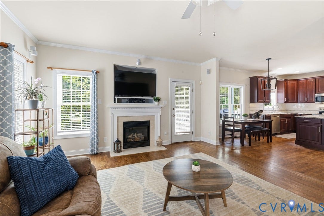 8343 Shagreen Court, The Highlands, Chesterfield, VA 23838 Fireplace with detailed mantel, wood-finish flooring, recessed lighting, ceiling fan, and built-in cabinetry