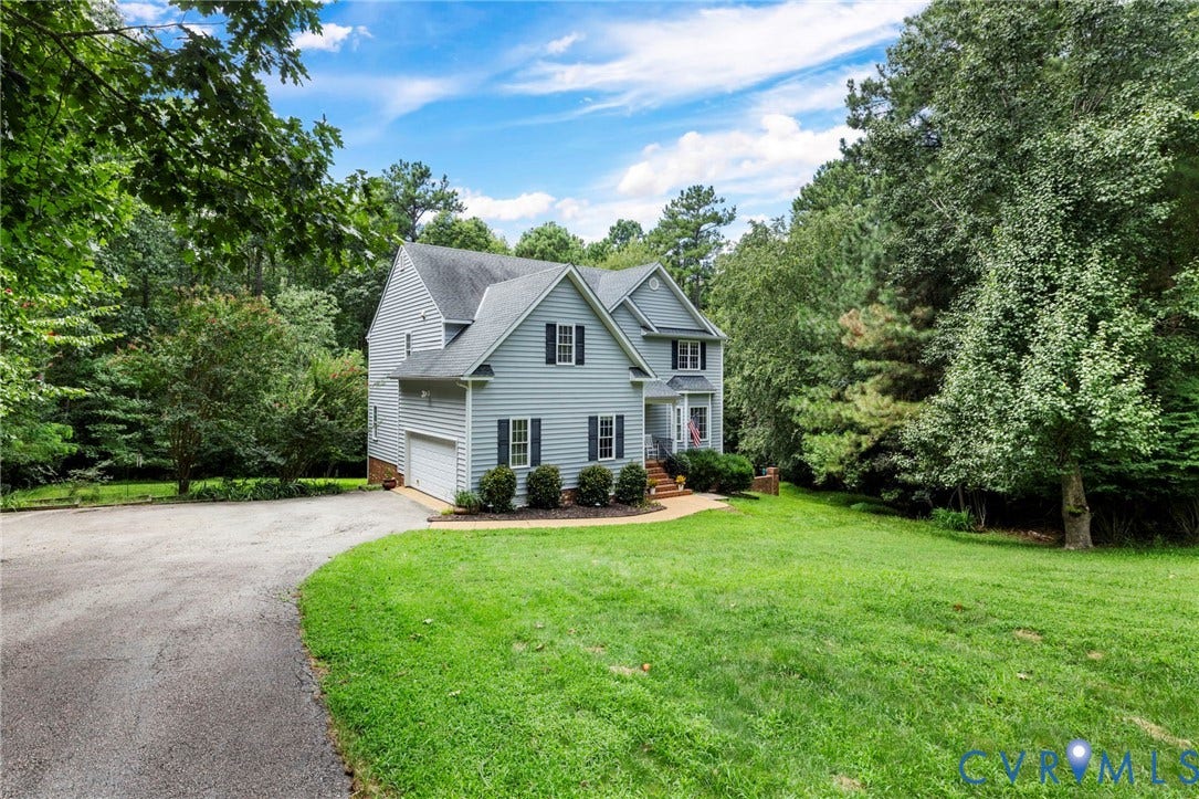 8343 Shagreen Court, The Highlands, Chesterfield, VA 23838 Two-story siding exterior with a gabled roof, attached garage, and paved driveway
