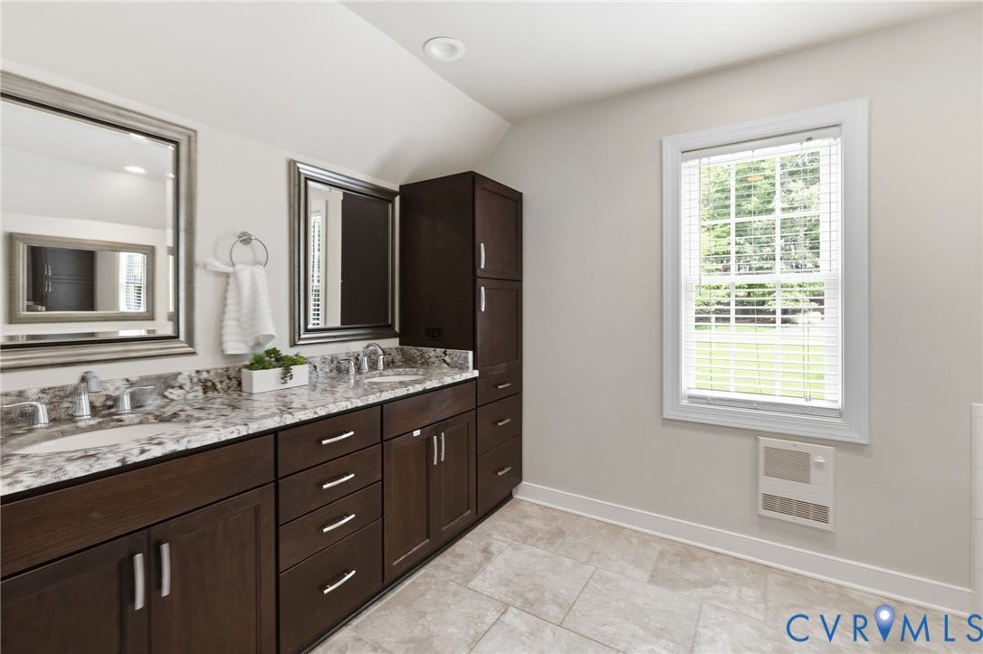 8343 Shagreen Court, The Highlands, Chesterfield, VA 23838 Dual vanity with undermount sinks and granite countertops, dark wood-finish cabinetry, framed mirrors, and tile flooring