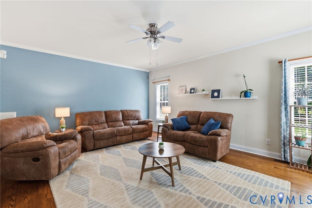8343 Shagreen Court, The Highlands, Chesterfield, VA 23838 Hardwood flooring, crown molding, ceiling fan with light fixture, and two windows with blinds
