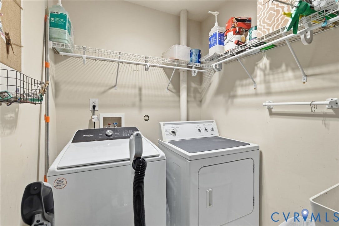 8343 Shagreen Court, The Highlands, Chesterfield, VA 23838 Integrated laundry appliances with white overhead wire shelving and a wall-mounted hanging rod