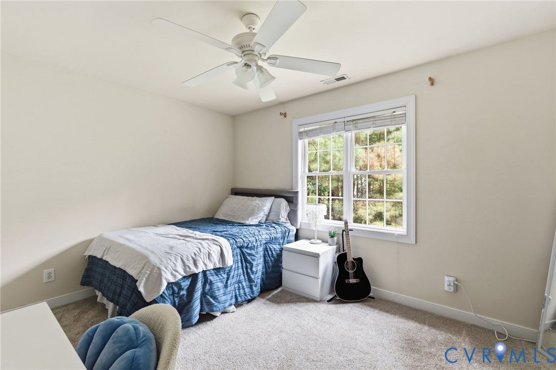 8343 Shagreen Court, The Highlands, Chesterfield, VA 23838 White ceiling fan with light, white window trim, light-colored carpeting, light-toned wall paint, and a large window