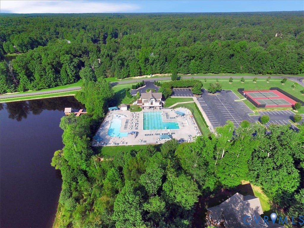 8343 Shagreen Court, The Highlands, Chesterfield, VA 23838 Lakefront property featuring a community pool, tennis courts, and expansive tree coverage