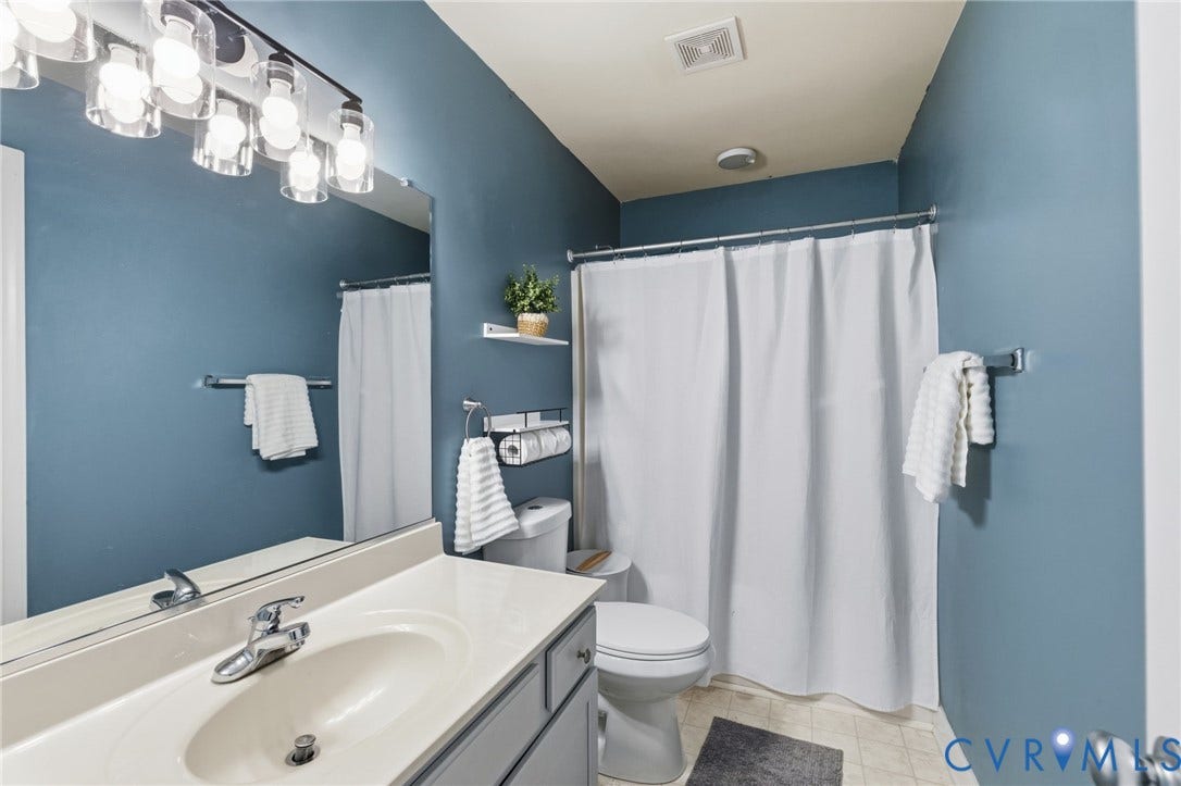 8343 Shagreen Court, The Highlands, Chesterfield, VA 23838 Vanity with integrated sink, chrome faucet, and overhead bar lighting fixture
