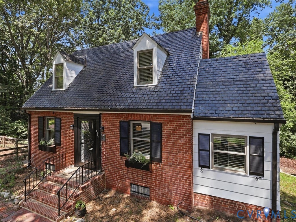 Brick facade with white siding accents
