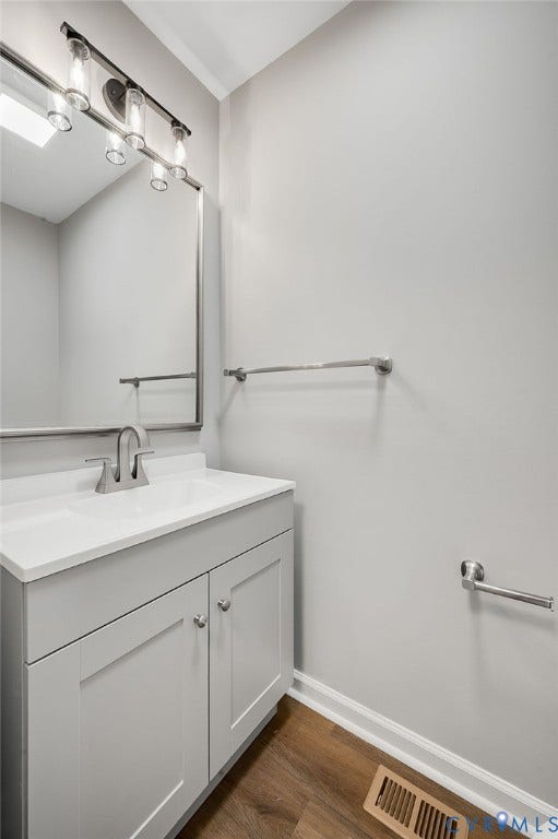 425 BYRNE Street, Petersburg, VA 23803 Vanity with light gray shaker-style cabinetry, a white countertop, and an undermount sink