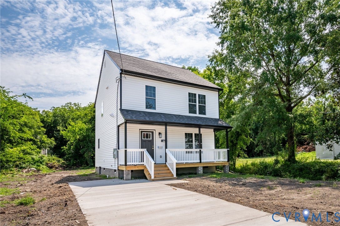 425 BYRNE Street, Petersburg, VA 23803 Two-story residence featuring white siding, a covered front porch with white railings, and a dark asphalt shingle roof