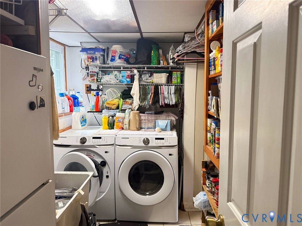 4900 Cord Court, Bridgewood, Glen Allen, VA 23060 Front-loading washer and dryer, built-in shelving, and a single window