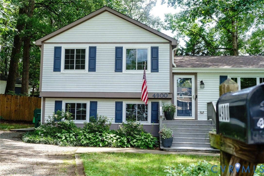 4900 Cord Court, Bridgewood, Glen Allen, VA 23060 White siding exterior with blue window shutters, gray front steps, and a dark entry door