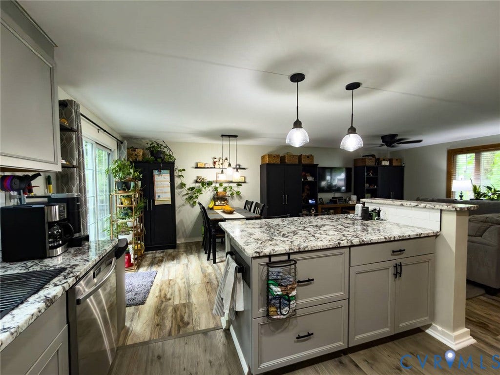 4900 Cord Court, Bridgewood, Glen Allen, VA 23060 Kitchen island with light gray cabinetry and speckled countertop