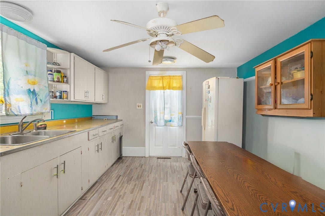 5927 Swanson Road, Richmond, VA 23225 Kitchen featuring wood-finish flooring, white cabinetry, and a ceiling fan