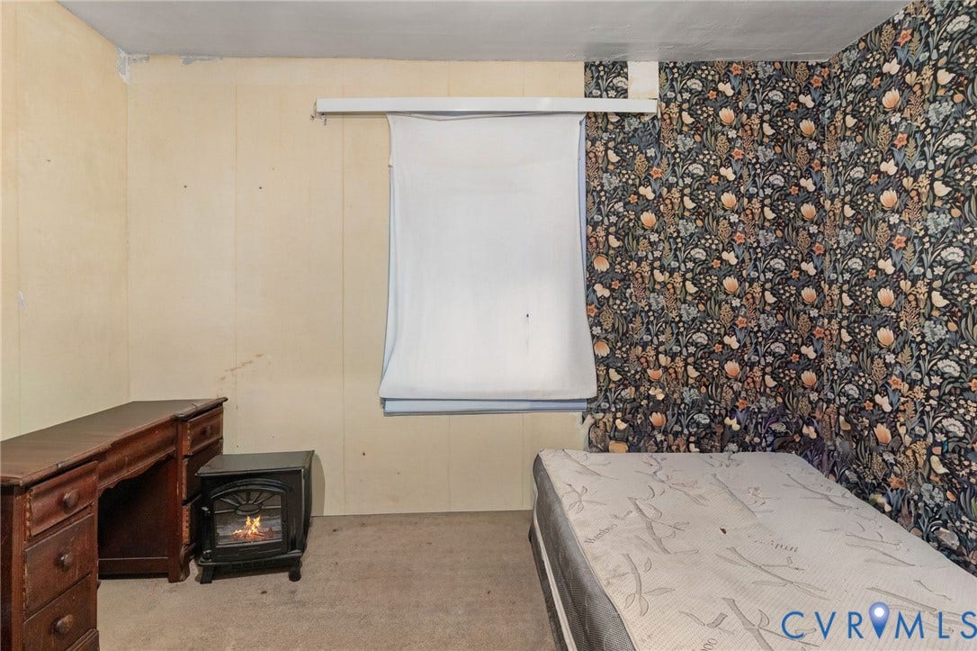 5927 Swanson Road, Richmond, VA 23225 Room featuring floral pattern wallpaper, a window, and carpet flooring