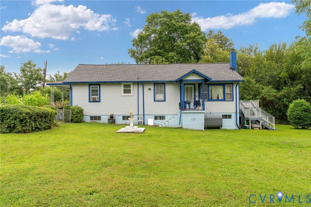 5927 Swanson Road, Richmond, VA 23225 White siding exterior with blue trim accents and a dark shingle roof