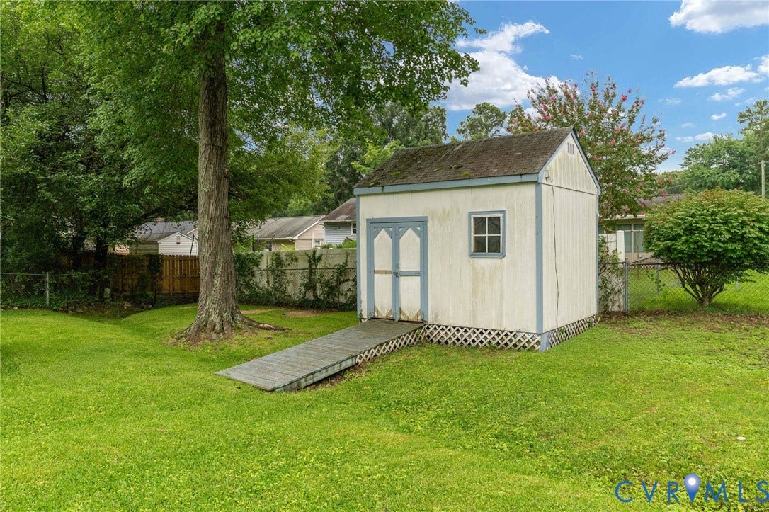 5927 Swanson Road, Richmond, VA 23225 Detached storage shed with a gable roof, single window, and double doors