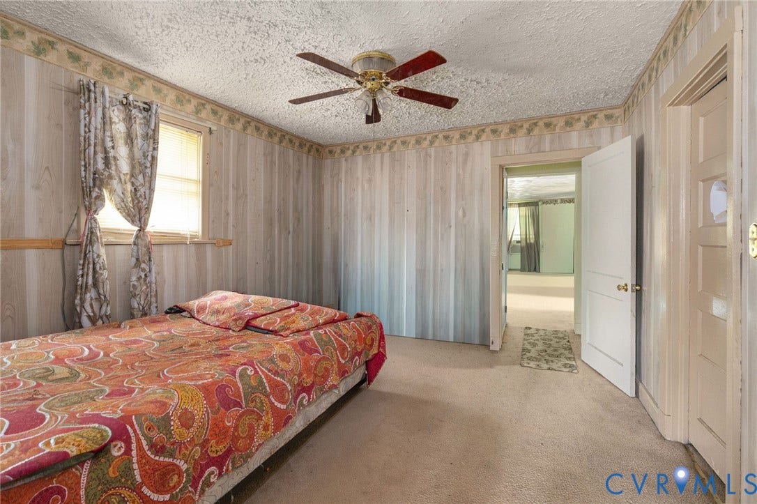 5927 Swanson Road, Richmond, VA 23225 Carpeted room featuring a ceiling fan, a window with horizontal blinds, and paneled walls with decorative border trim