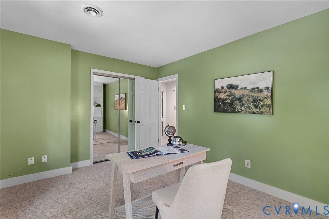 Neutral carpeting with light green walls