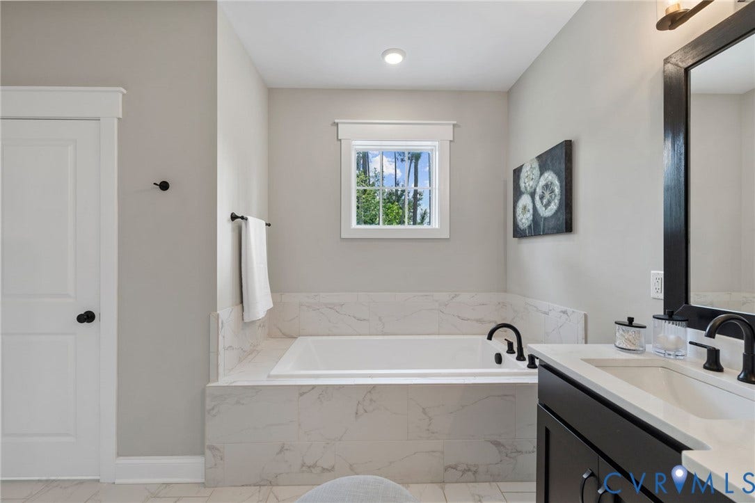7237 Bonallack Bend, Carlton Ridge, Moseley, VA 23120 Oversized soaking tub with surround tiling, enclosed toilet area