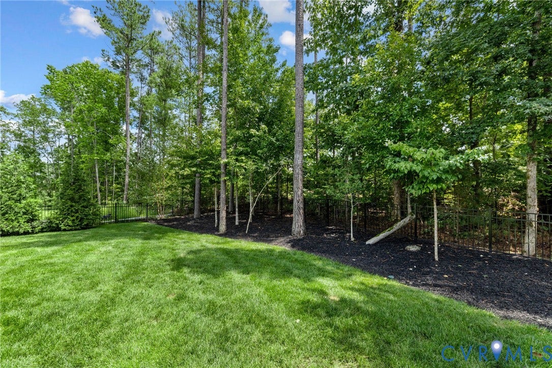 7237 Bonallack Bend, Carlton Ridge, Moseley, VA 23120 Expansive manicured lawn with mature trees and natural woodland backdrop