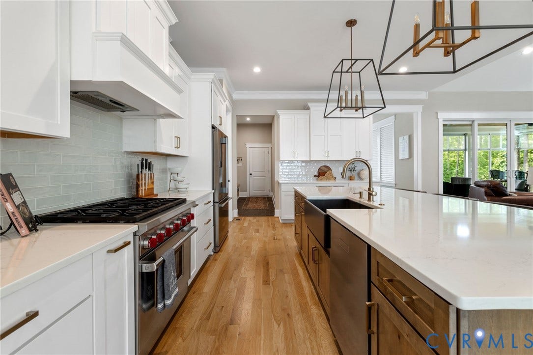7237 Bonallack Bend, Carlton Ridge, Moseley, VA 23120 Large center island with warm tone wood cabinets, farmhouse sink, view to mud room