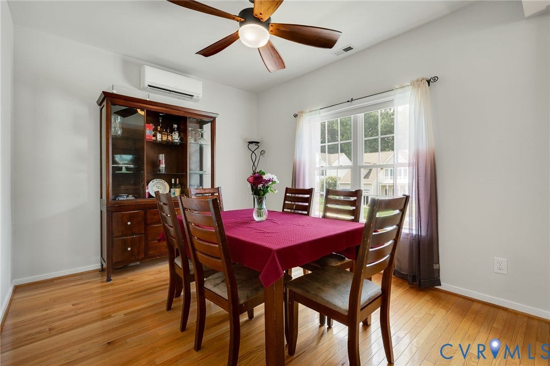 10620 Correnty Drive, Henrico, VA 23059 Dining area featuring wood-finish flooring, a ceiling fan with integrated lighting, and a large window providing ample natural light