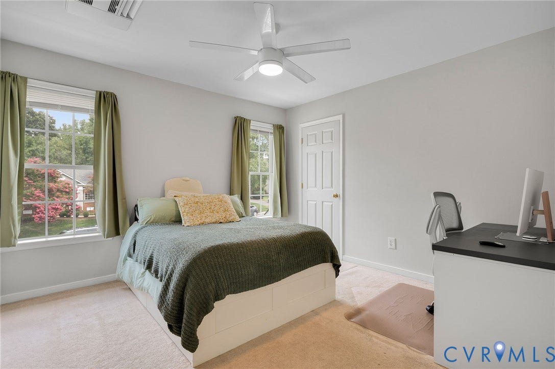 10620 Correnty Drive, Henrico, VA 23059 Carpeted room featuring two window sets with exterior landscaping views