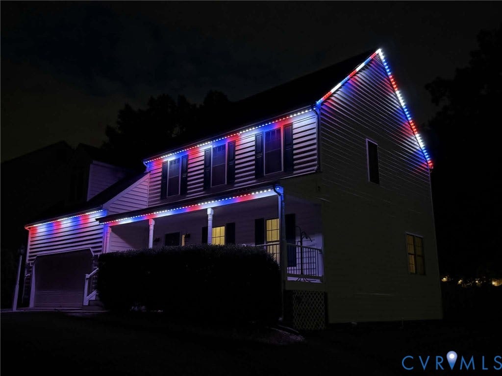 10620 Correnty Drive, Henrico, VA 23059 Two-story residence featuring horizontal siding and a prominent two-car garage and 4th of July lights