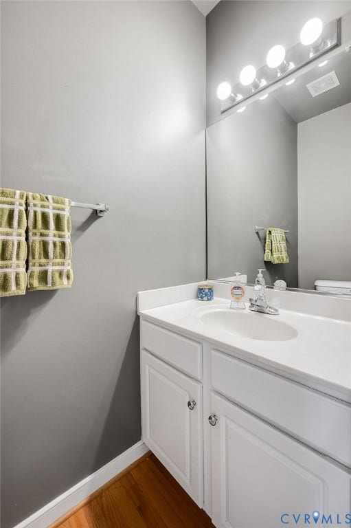 10620 Correnty Drive, Henrico, VA 23059 Modern bathroom vanity featuring a white cabinetry base with dual drawers, white quartz countertop, and an integrated white porcelain sink