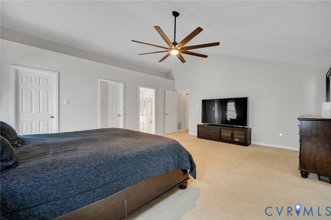 10620 Correnty Drive, Henrico, VA 23059 Expansive bedroom featuring a vaulted ceiling and a contemporary ceiling fan with wood-finish blades