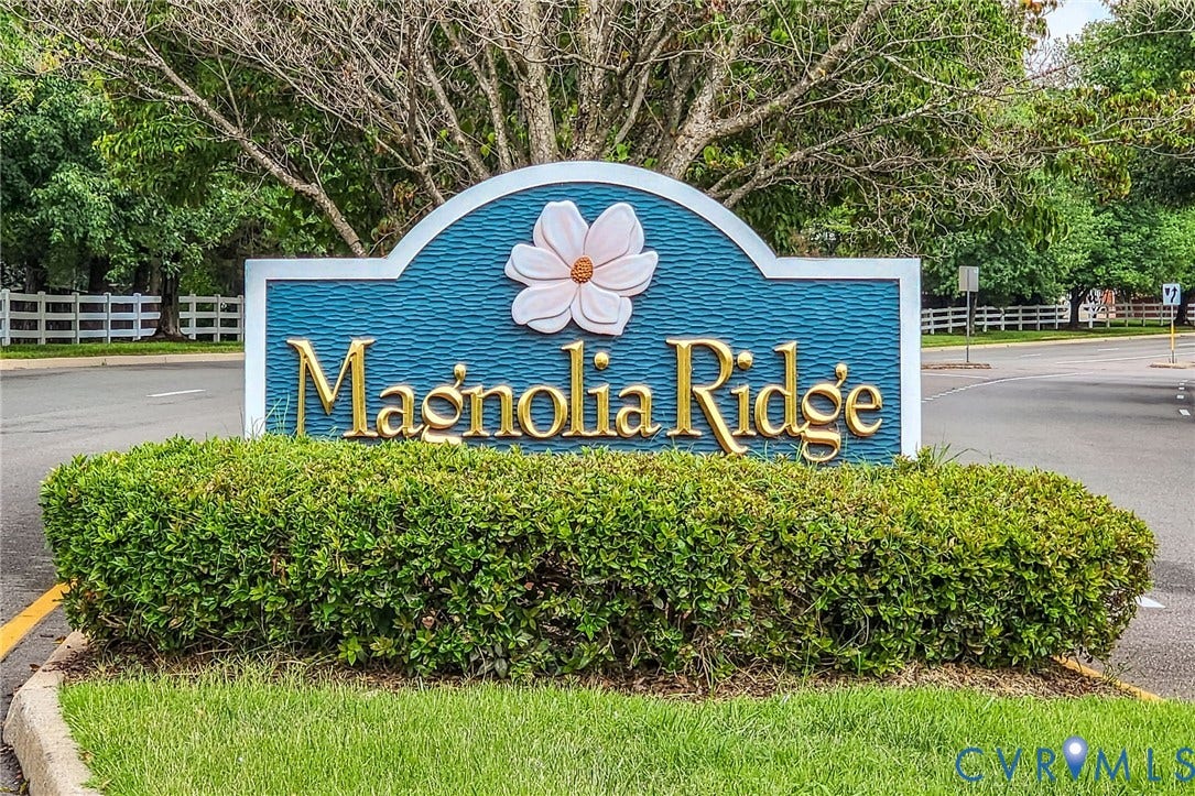 10620 Correnty Drive, Henrico, VA 23059 Magnolia Ridge community entrance sign with gold lettering and a white magnolia flower emblem