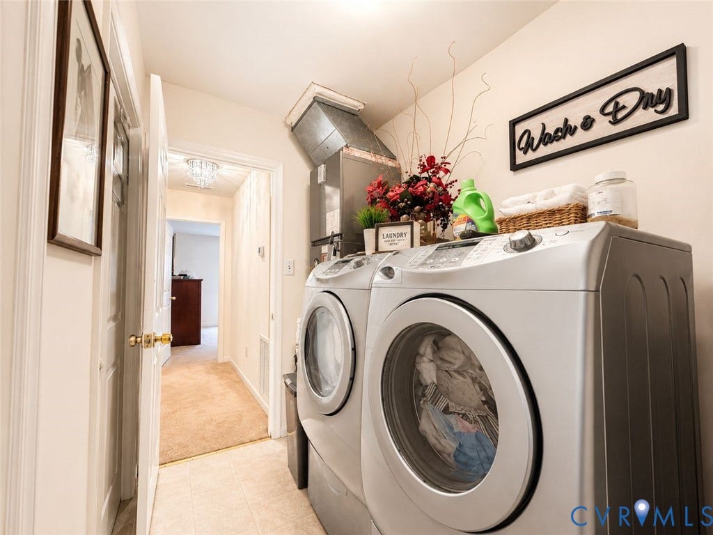 Amelia, VA 23966 Dedicated laundry area featuring tile flooring, neutral wall paint, and a visible HVAC duct system