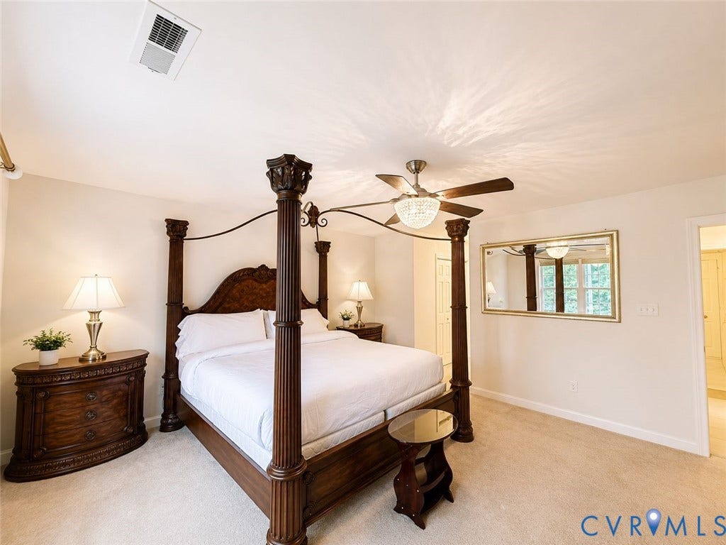 Amelia, VA 23966 Spacious bedroom featuring light-toned carpeting, a ceiling fan with integrated lighting, and neutral wall tones