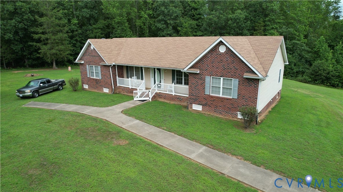 Amelia, VA 23966 Brick and siding exterior featuring a gable roof and a covered front porch