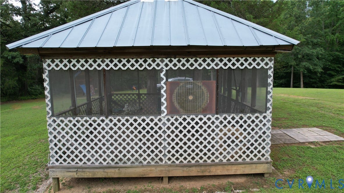 Amelia, VA 23966 Freestanding screened gazebo with a metal roof and lattice detailing