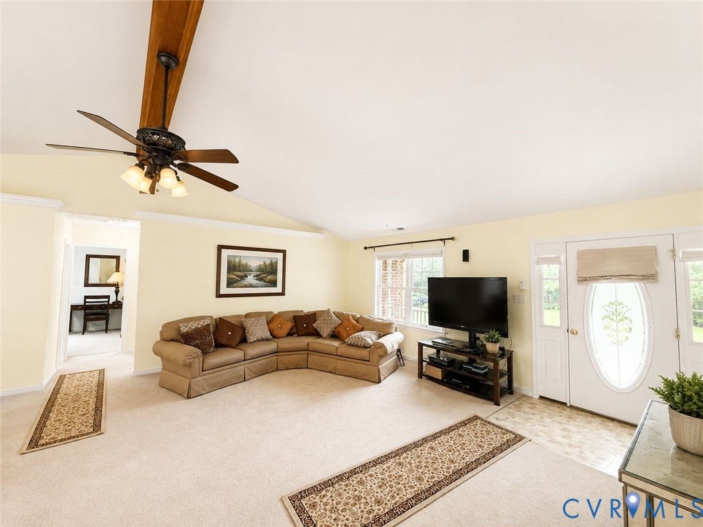 Amelia, VA 23966 Vaulted ceiling with an exposed wood beam and ceiling fan