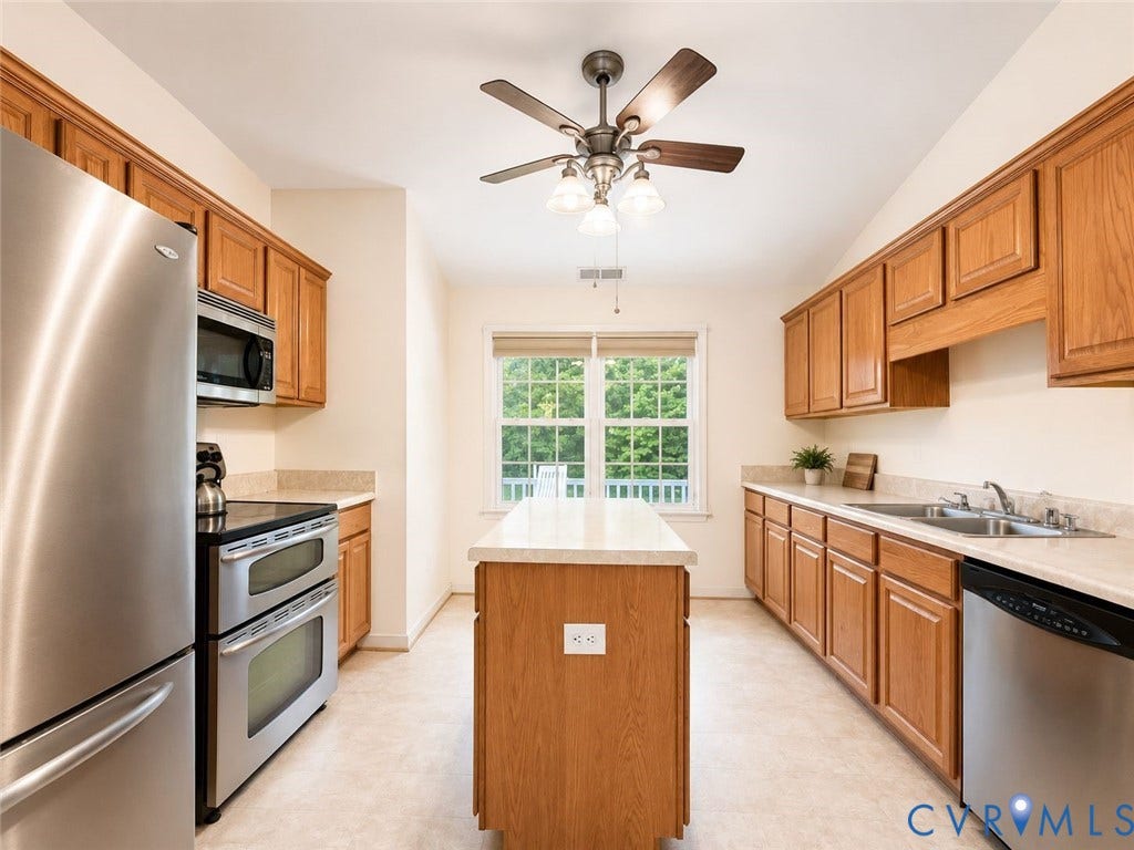 Amelia, VA 23966 Kitchen featuring wood cabinetry and light-toned countertops