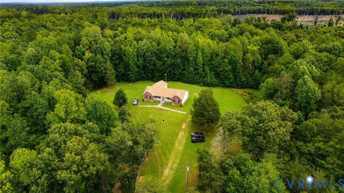 Amelia, VA 23966 Aerial perspective showcasing a single-story residence surrounded by extensive mature trees