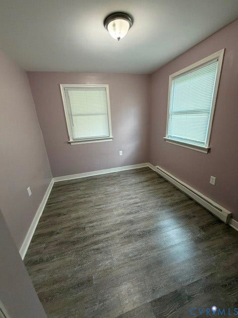 11925 Wedge Drive, Chester, VA 23831 Room featuring wood-finish flooring, two windows with white blinds, and a flush mount ceiling light fixture