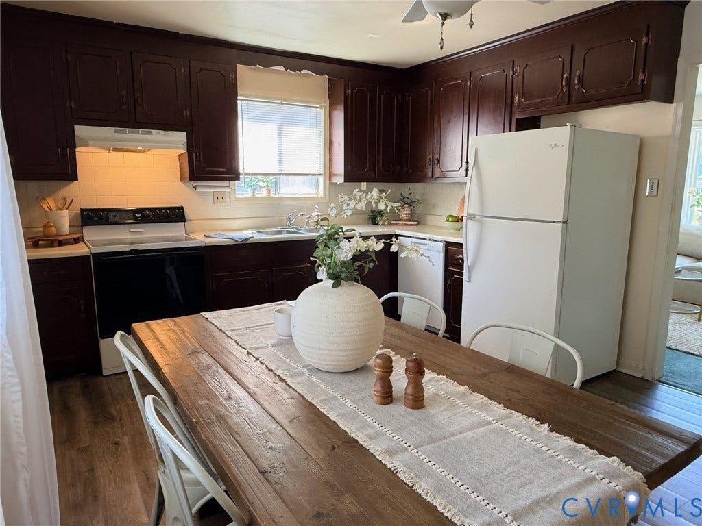 6401 Lythgoe Avenue, North Chesterfield, VA 23234 Kitchen featuring wood-finish flooring, white subway tile backsplash, and dark wood cabinetry