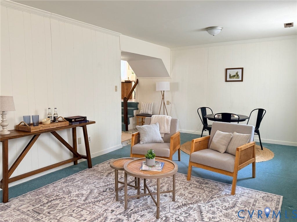 6401 Lythgoe Avenue, North Chesterfield, VA 23234 Light-colored vertical paneling, crown molding, and a built-in staircase
