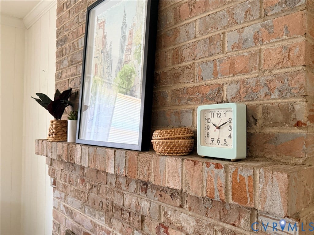 6401 Lythgoe Avenue, North Chesterfield, VA 23234 Exposed brick fireplace with a substantial brick mantel