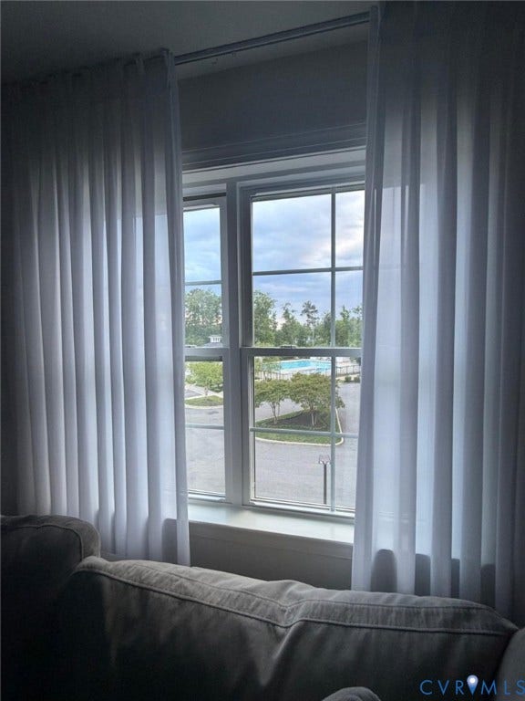 4516 Bacova Club Court, Glen Allen, VA 23059 White framed window with grid inserts overlooking a landscaped area and a swimming pool