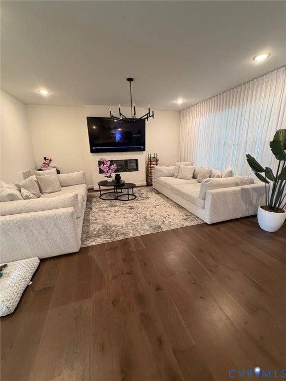 4516 Bacova Club Court, Glen Allen, VA 23059 Dark wood-finish flooring, recessed lighting, and a modern black chandelier