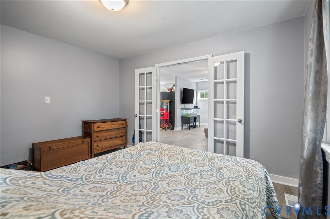 3940 Three Bridge Road, Powhatan, VA 23139 French doors opening into an interior room with wood-finish flooring