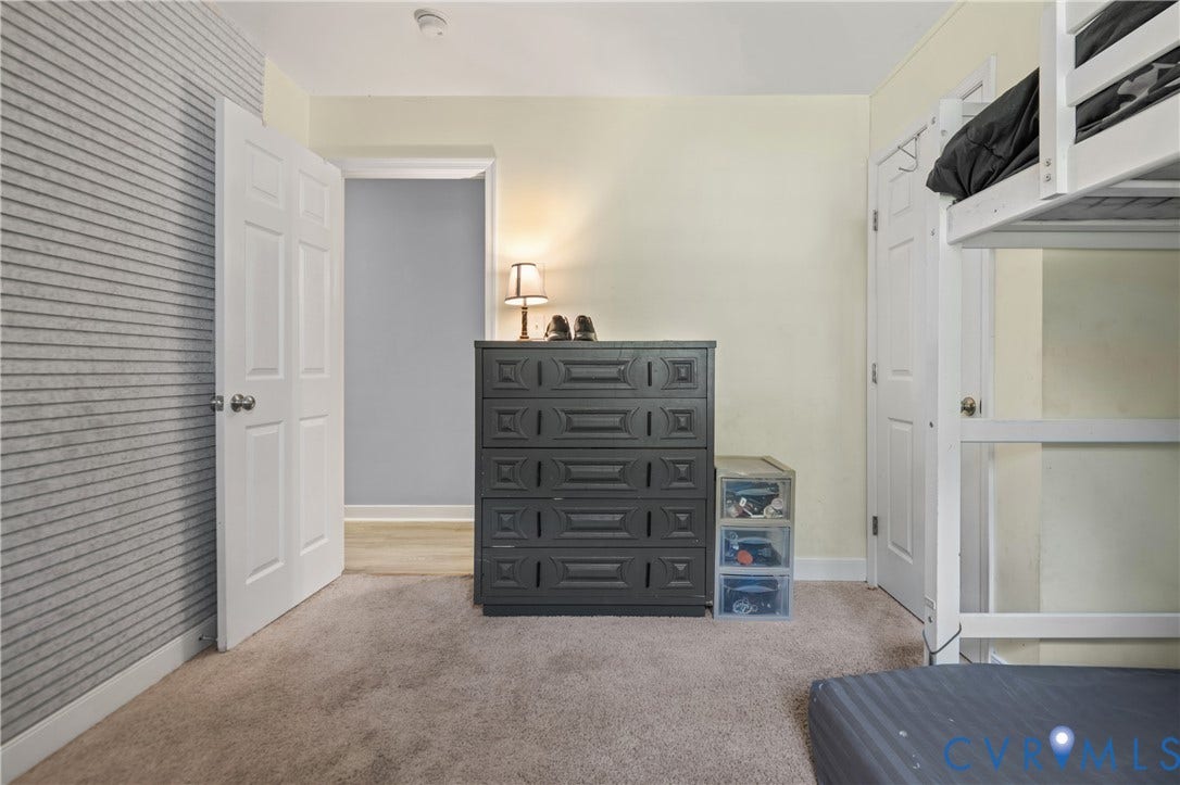 3940 Three Bridge Road, Powhatan, VA 23139 Wall-to-wall carpeting, paneled interior doors, and a striped accent wall