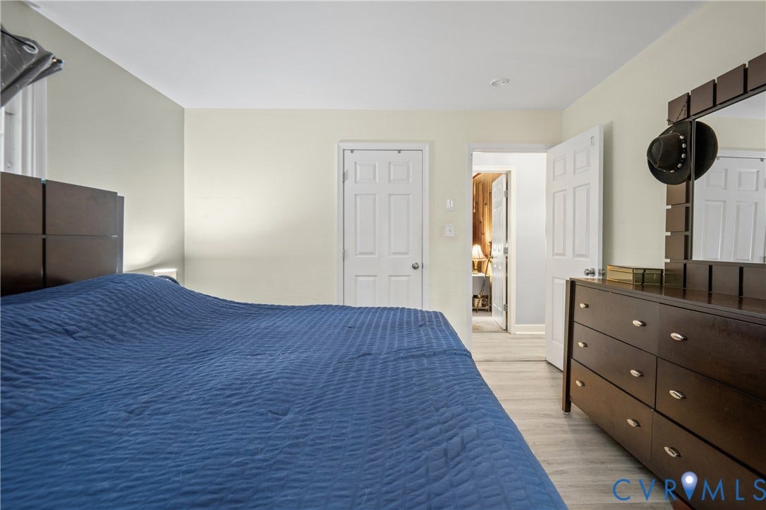 3940 Three Bridge Road, Powhatan, VA 23139 Light-toned walls, wood-finish flooring, and white trim